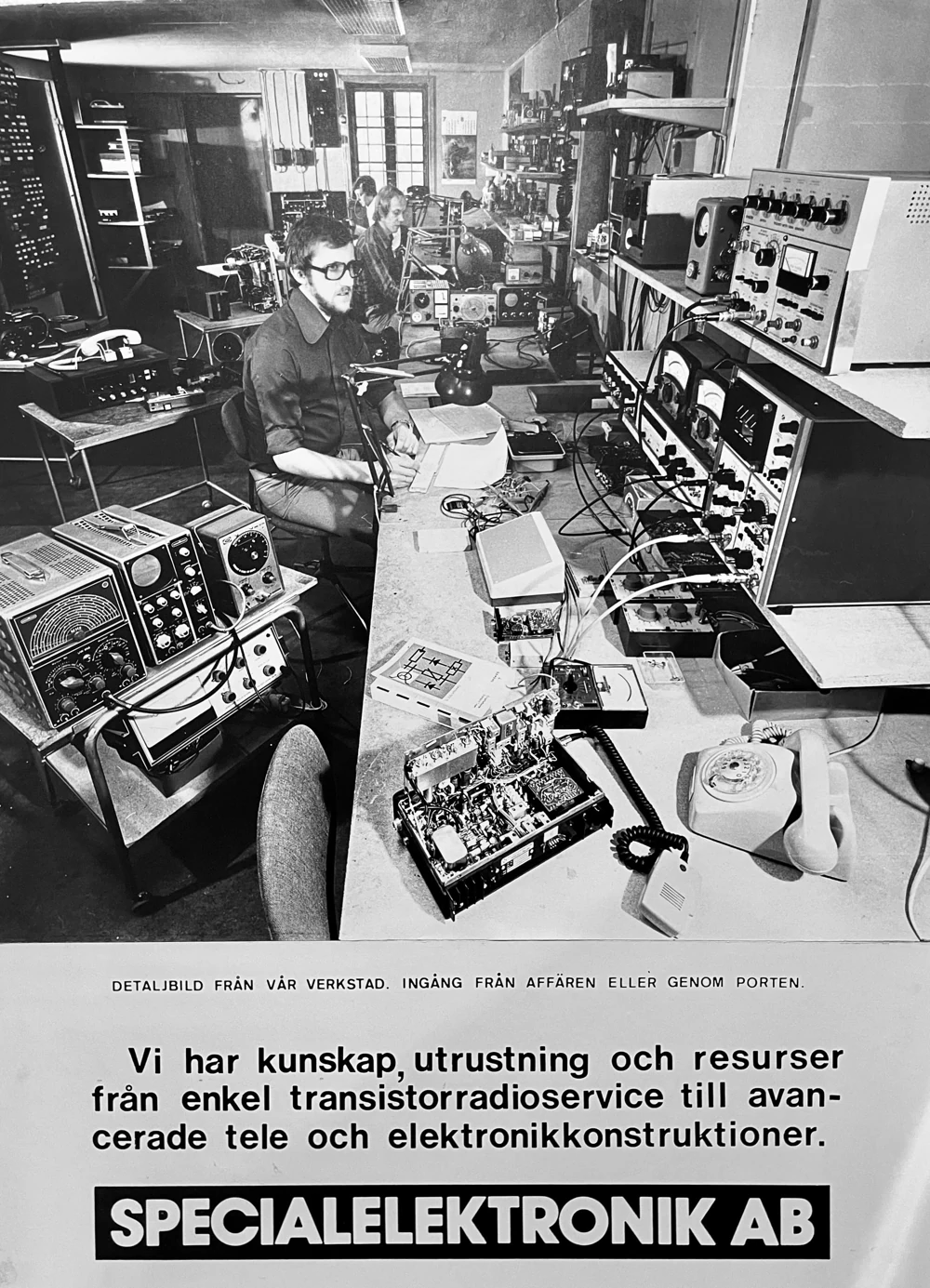 Archival photograph of the early electronics workshop, with technicians and radio test equipment